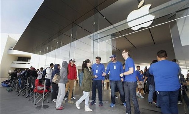 iPhone customers lined up outside an Apple store iPhone customers lined up outside an Apple store